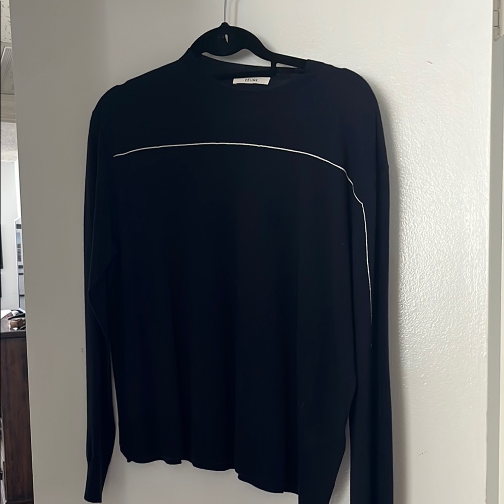 Celine navy sweater with white pinstripe.